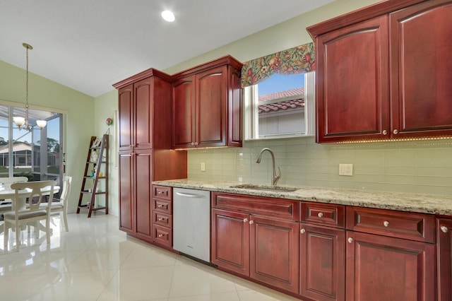 kitchen with dishwasher, an inviting chandelier, sink, light stone countertops, and decorative light fixtures