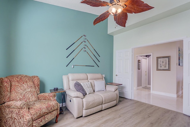 sitting room with ceiling fan and light hardwood / wood-style floors