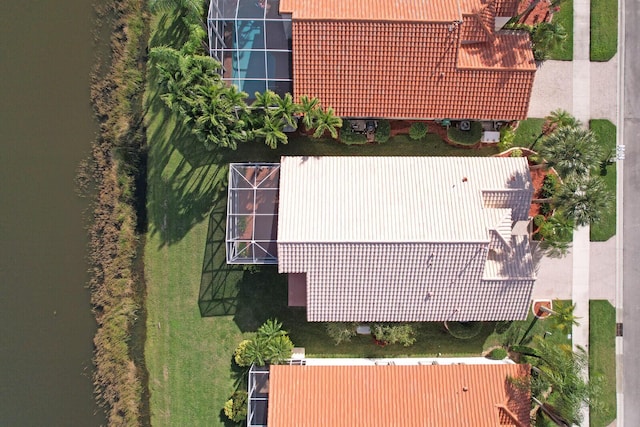 birds eye view of property featuring a water view