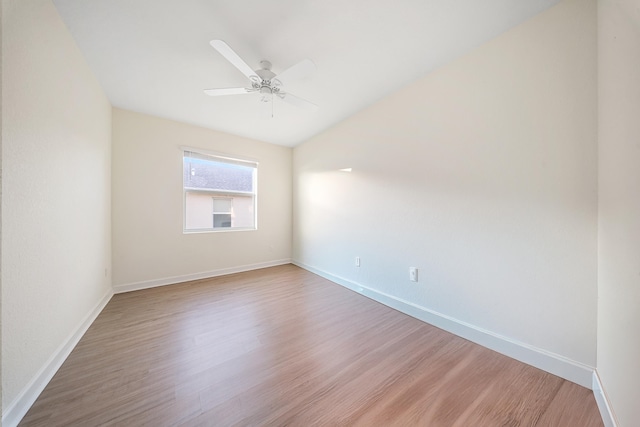 spare room featuring ceiling fan and hardwood / wood-style flooring