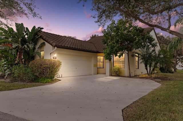 mediterranean / spanish-style house featuring a garage