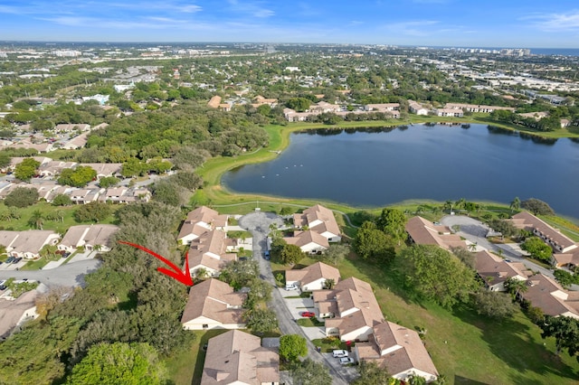 birds eye view of property with a water view