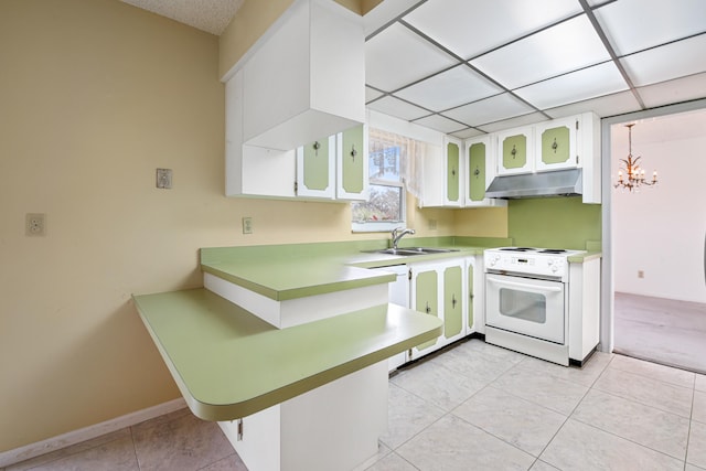 kitchen with white appliances, sink, a notable chandelier, white cabinets, and light tile patterned flooring