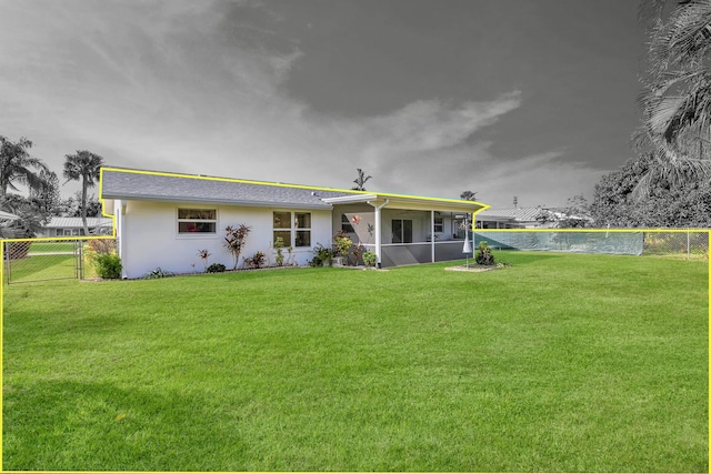 back of house featuring a yard and a swimming pool