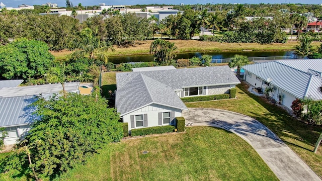 birds eye view of property featuring a water view