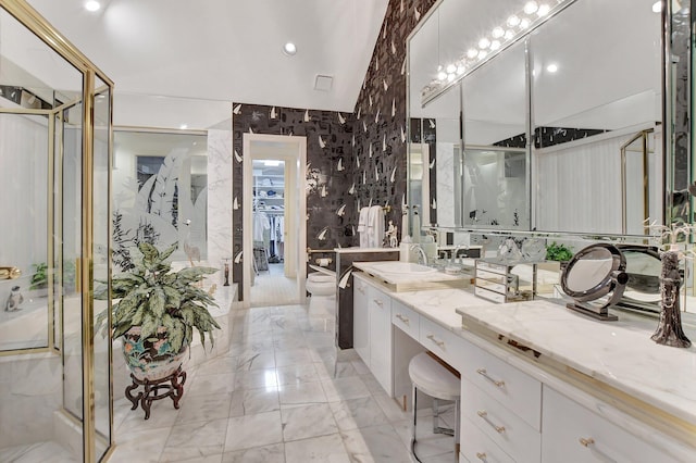 bathroom featuring vanity, toilet, a shower with door, and tile walls