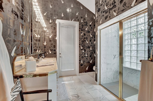 bathroom with vanity, toilet, a shower with door, and a wealth of natural light