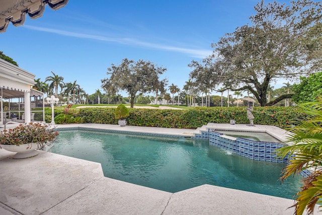 view of pool with an in ground hot tub and a patio