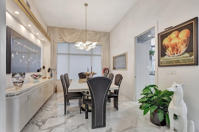 dining space featuring a chandelier