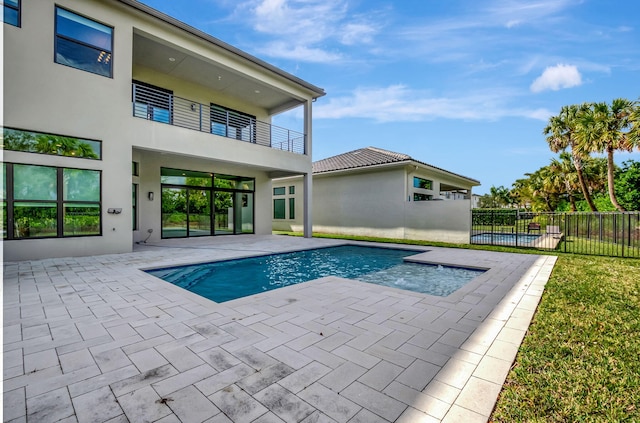 view of swimming pool featuring a patio area