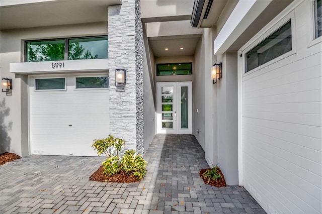 doorway to property featuring a garage