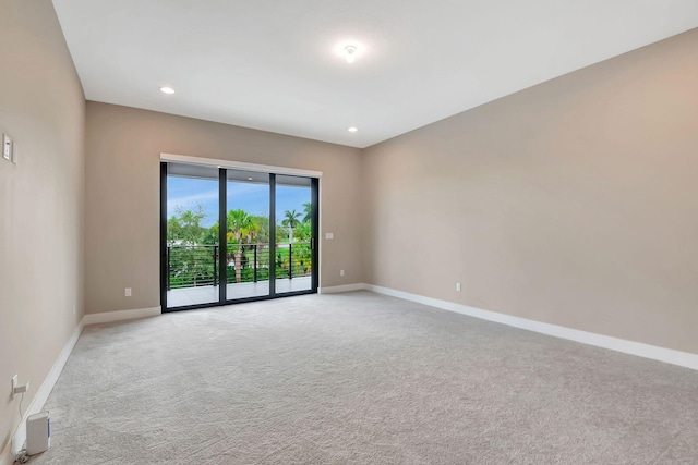 empty room featuring light carpet