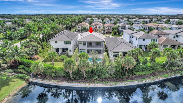 birds eye view of property with a water view