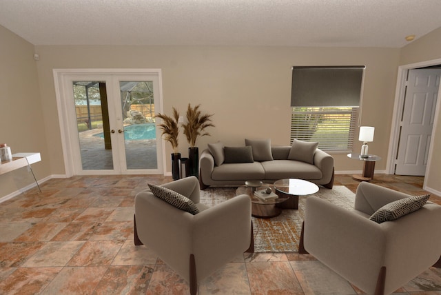 living room with french doors and a textured ceiling