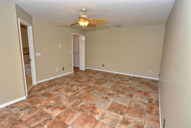 unfurnished room with a textured ceiling and ceiling fan