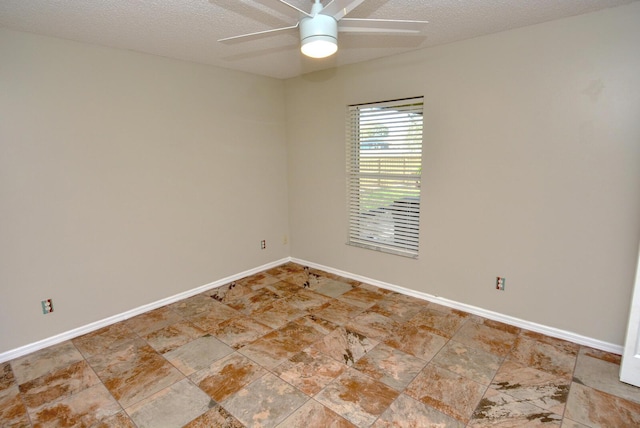 empty room featuring a textured ceiling and ceiling fan