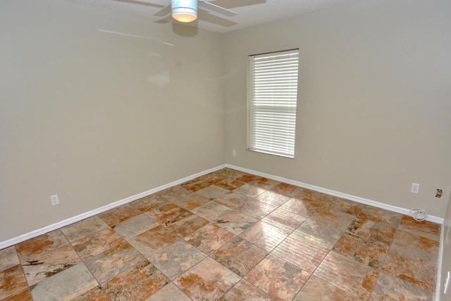 spare room featuring ceiling fan