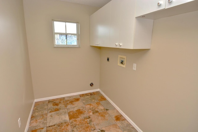 laundry room featuring washer hookup, electric dryer hookup, and cabinets