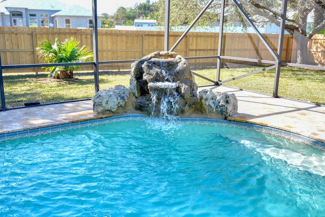 view of pool with pool water feature