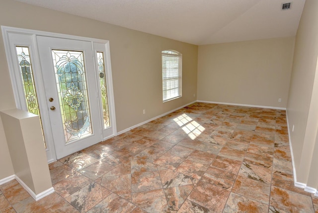 foyer entrance with vaulted ceiling