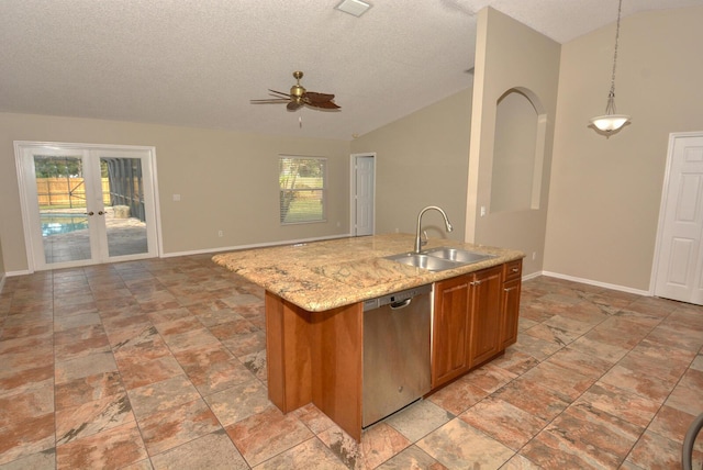 kitchen featuring stainless steel dishwasher, ceiling fan, sink, a center island with sink, and hanging light fixtures