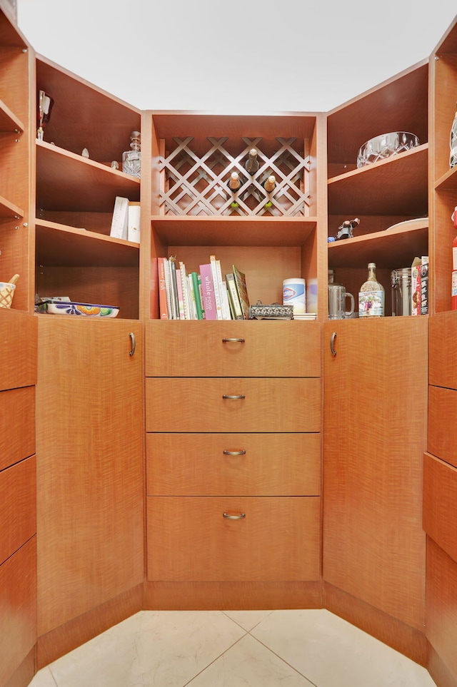 spacious closet featuring light tile patterned floors