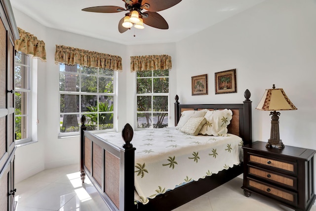 tiled bedroom with ceiling fan