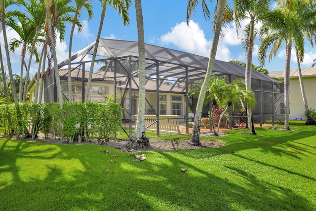 view of yard with glass enclosure