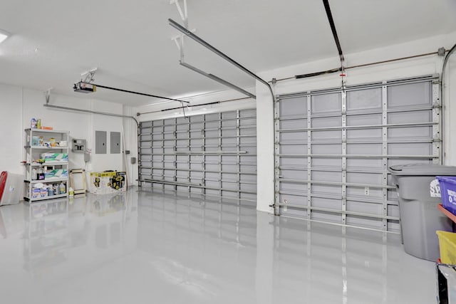 garage featuring a garage door opener and electric panel