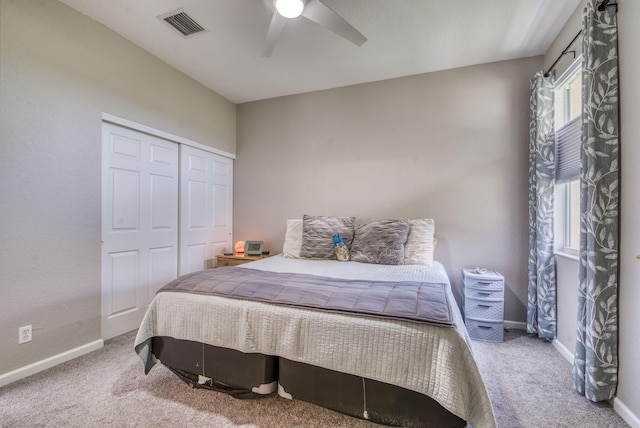 bedroom featuring a closet, ceiling fan, and carpet