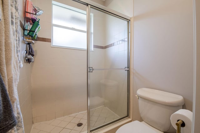 bathroom with walk in shower and toilet