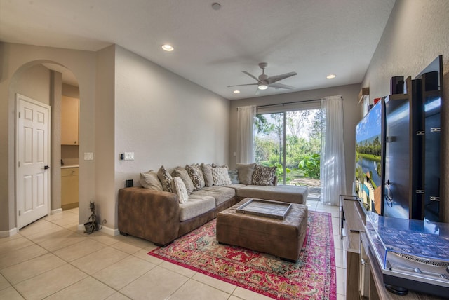 tiled living room featuring ceiling fan