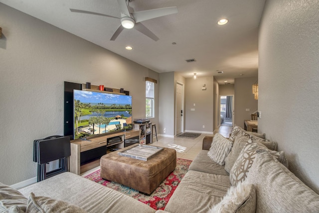 tiled living room with ceiling fan