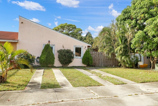 view of property exterior with a yard