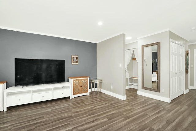 unfurnished living room with dark hardwood / wood-style floors and ornamental molding