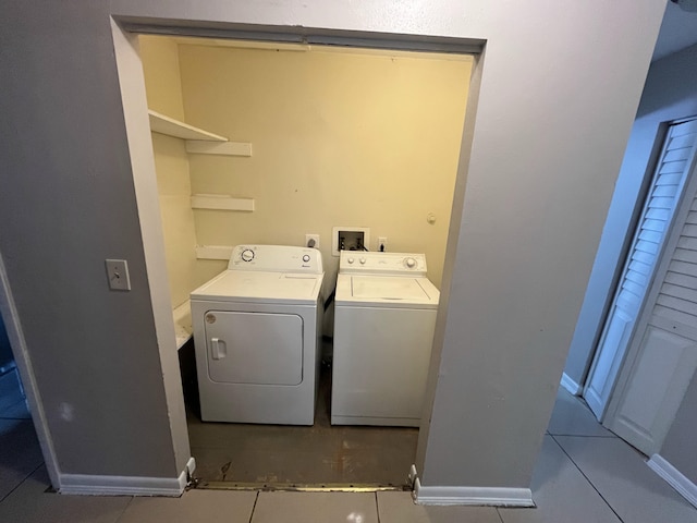 162 Booker Pl, Pahokee, FL 33476 - washroom with independent washer and dryer and tile patterned flooring