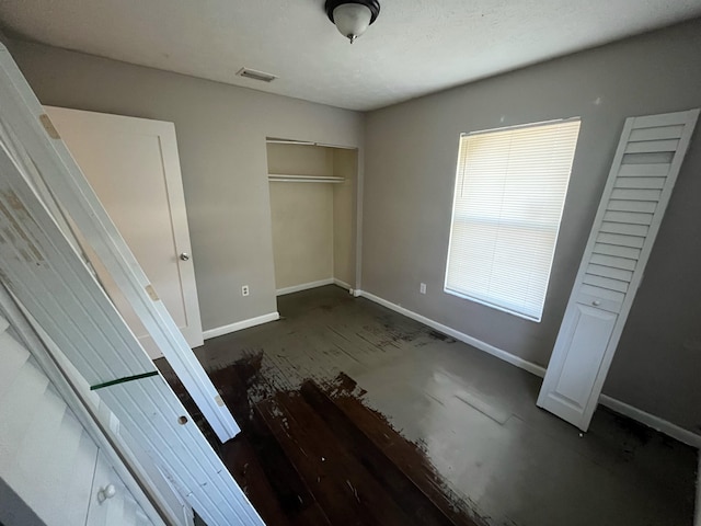 162 Booker Pl, Pahokee, FL 33476 - unfurnished bedroom featuring baseboards and a closet