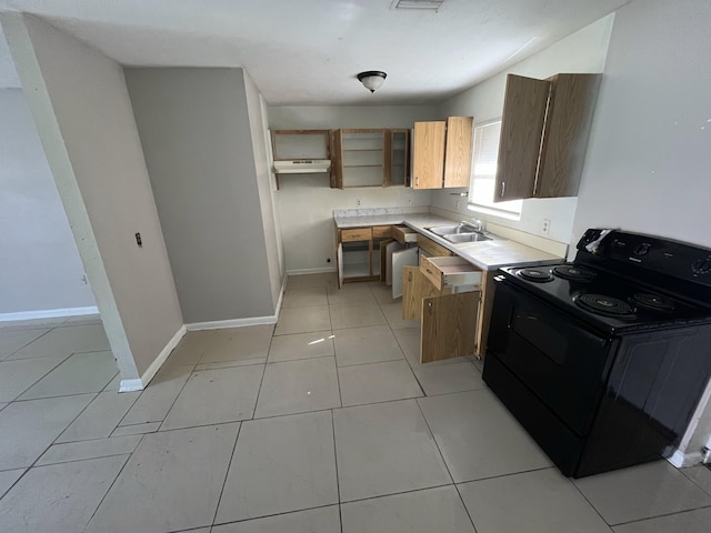 162 Booker Pl, Pahokee, FL 33476 - kitchen with black / electric stove, light countertops, light tile patterned flooring, under cabinet range hood, and open shelves