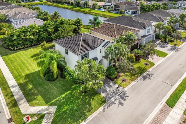 birds eye view of property featuring a water view