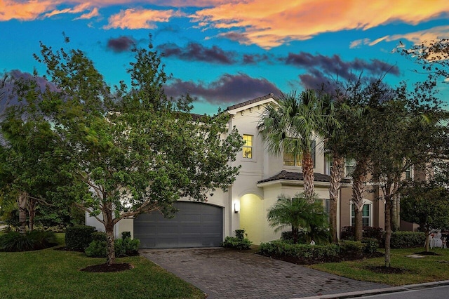 mediterranean / spanish-style house with a lawn