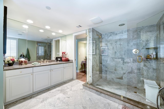 bathroom featuring vanity and walk in shower