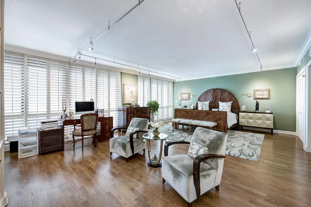 bedroom featuring dark wood-type flooring and ornamental molding