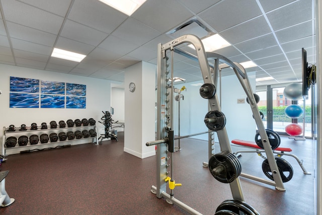 exercise room featuring a drop ceiling