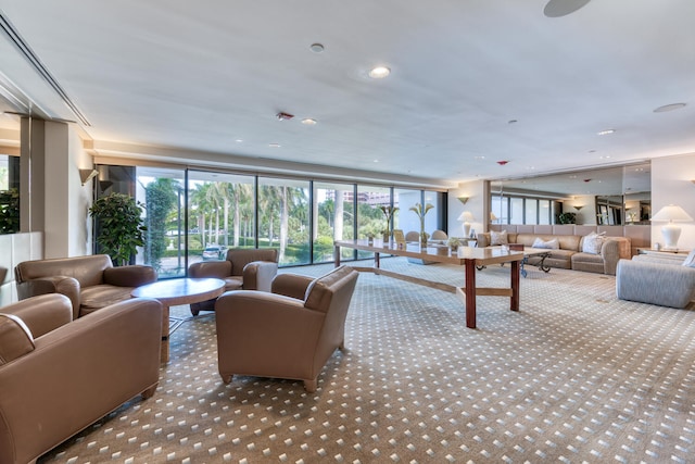 carpeted living room with floor to ceiling windows