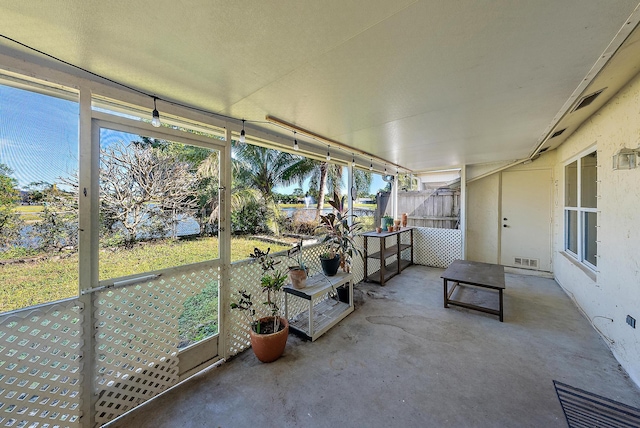 unfurnished sunroom featuring a healthy amount of sunlight