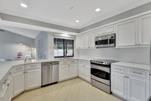 kitchen featuring white cabinets, crown molding, sink, and appliances with stainless steel finishes