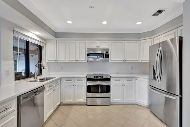 kitchen with white cabinets, crown molding, sink, and stainless steel appliances