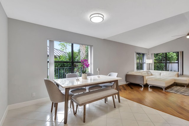 dining area with light wood-type flooring, ceiling fan, and lofted ceiling