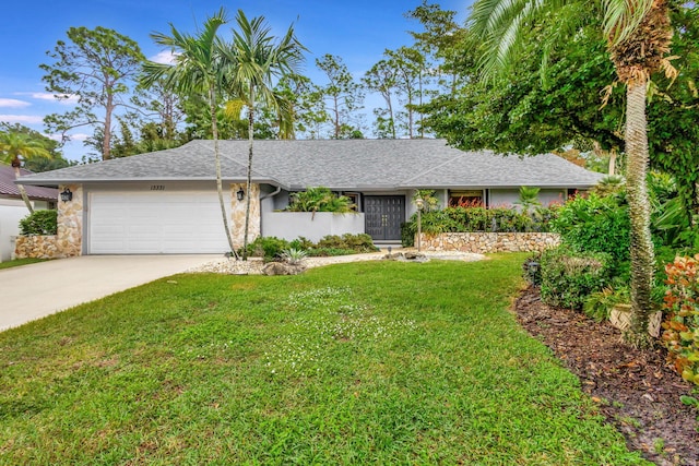 ranch-style home with a front lawn and a garage