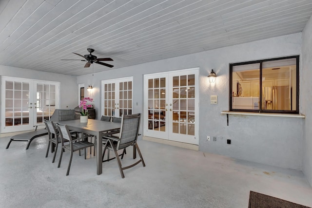 sunroom / solarium with ceiling fan and french doors